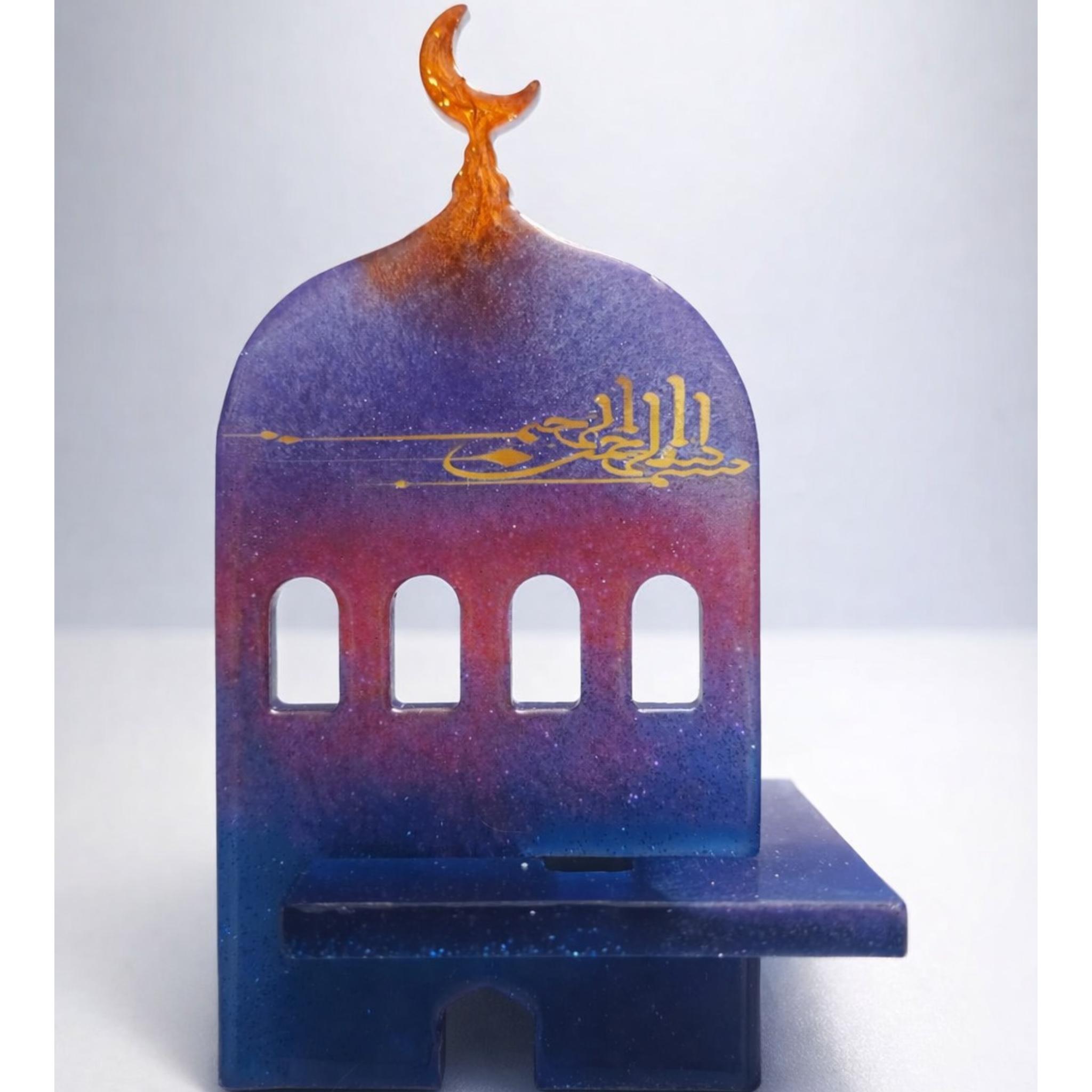 Support de téléphone portable en résine bleue et violette avec dôme de mosquée et calligraphie dorée.